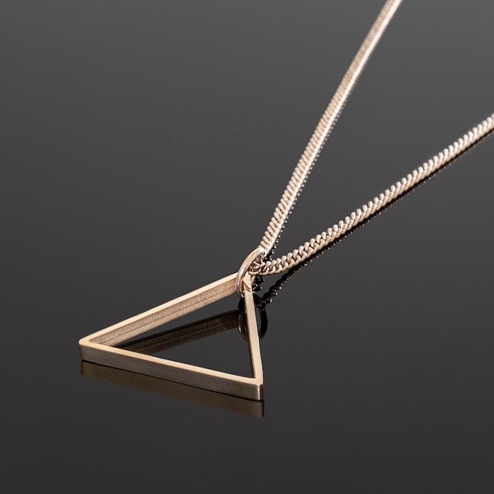 Our Rose Gold Triangle Necklace features our Signature Triangle Pendant and Cuban Link Chain. The Perfect piece for any wardrobe.
